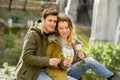 Young sweet couple in love kissing tenderly on street celebrating Valentines day or anniversary cheering in Champagne Royalty Free Stock Photo