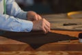 Young tailor marking fabric with chalk in atelier Royalty Free Stock Photo