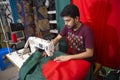 A young tailor Md. Rashed Alam , Age 28 making Bangladeshi national flags at Dhaka, Bangladesh. Royalty Free Stock Photo