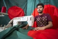 A young tailor Md. Rashed Alam , Age 28 making Bangladeshi national flags at Dhaka, Bangladesh. Royalty Free Stock Photo