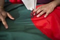 A young tailor Md. Rashed Alam , Age 28 making Bangladeshi national flags at Dhaka, Bangladesh. Royalty Free Stock Photo