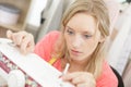 young tailor woman working in workshop on sewing machine Royalty Free Stock Photo