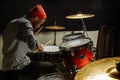 Young talented man emotionally play the drums