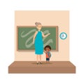 Young teacher female with schoolboy classroom scene Royalty Free Stock Photo