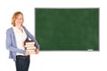 Young teacher in front of an empty chalkboard Royalty Free Stock Photo