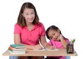 Young Teacher helping child with writing lesson isolated on white background Royalty Free Stock Photo