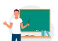 A young teacher man on the background of a blackboard with a pointer. A male with a like gesture. Royalty Free Stock Photo