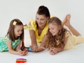 Young teacher and preschool children learn the English alphabet using cards, blocks and toys Royalty Free Stock Photo