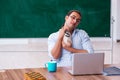 Young male teacher in remuneration concept Royalty Free Stock Photo