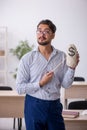 Young male teacher in remuneration concept Royalty Free Stock Photo