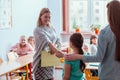 Teacher and student in the classroom during the first maths lesson Royalty Free Stock Photo