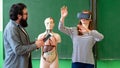 Young teacher using Virtual Reality Glasses and 3D presentation. Education, VR, Tutoring, New Technologies and Teaching Methods.
