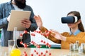 Young teacher using Virtual Reality Glasses and 3D presentation to teach students in chemistry class. Education, VR, Tutoring. Royalty Free Stock Photo