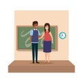 Young teachers couple with chalkboard in classroom scene