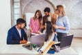 Team of coworkers making great meeting discussion in modern coworking office Royalty Free Stock Photo