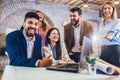 Team of coworkers making great meeting discussion in modern coworking office Royalty Free Stock Photo