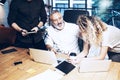 Young team of coworkers making great work discussion in modern office.Bearded man talking with marketing director and Royalty Free Stock Photo