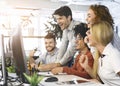 Young team of excited coworkers celebrating in office Royalty Free Stock Photo