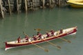 Young team on rowing boat at Clovelly, Devon