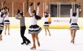 Young team from a school of skating on ice performs at the International Cup