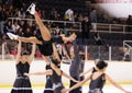 Young team from a school of skating on ice performs at the International Cup