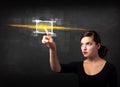 Young tech lady touching button with orange light beams concept Royalty Free Stock Photo