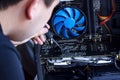 Technician hold the screwdriver for repairing the computer in his hand. hardware, service,upgrade and technology repairing concept Royalty Free Stock Photo