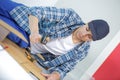 young technician installing floor at construction site Royalty Free Stock Photo