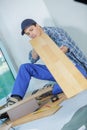 young technician installing floor at construction site Royalty Free Stock Photo