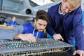 Young technician looking at aircrafts control panel Royalty Free Stock Photo