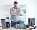 Young technician repairing computer in workshop Royalty Free Stock Photo