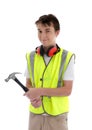 Young teen apprentice builder holding hammer Royalty Free Stock Photo