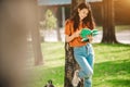 A young or teen asian girl student in university smiling and reading the boo Royalty Free Stock Photo