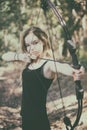 Teen girl with bow and arrow Royalty Free Stock Photo