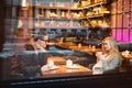 Young teen boy-girl couple, on date gazing into each other