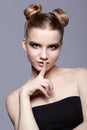 Young teen female beauty portrait with day makeup and bun hair s Royalty Free Stock Photo