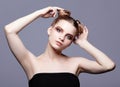 Young teen female beauty portrait with day makeup and bun hair s Royalty Free Stock Photo