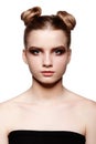 Young teen female beauty portrait with day makeup and bun hair Royalty Free Stock Photo