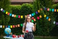 Young teen girl in glasses in school uniform playing with red Newton apple Royalty Free Stock Photo