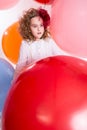 Young teen girl in a hat and white dress on a background of big Royalty Free Stock Photo