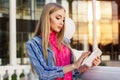 Young teen girl is holding her tablet computer Royalty Free Stock Photo