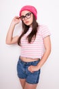 Young teen girl in pink hat and glasses Royalty Free Stock Photo