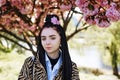 young teen girl in spring blooming cherry blossoms garden Royalty Free Stock Photo