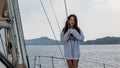 Young teen girl standing on sailboat Royalty Free Stock Photo