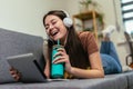 Girl using digital tablet computer listening music at home Royalty Free Stock Photo