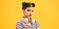 Young teen girl wireless headphones around neck, isolated on yellow background Royalty Free Stock Photo