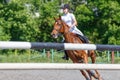 Young teen rider girl on show jumping competition Royalty Free Stock Photo