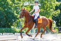 Young teen rider girl on show jumping competition Royalty Free Stock Photo