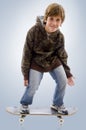 Young teen skateboarder with board