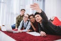 young teen students lying on carpet Royalty Free Stock Photo